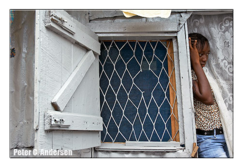 From her room, a girl observes a 'pull nar door' (naming) ceremony.