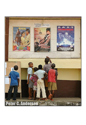 Children check upcoming films at the cinema.