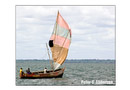 A sailboat passes Kingtom.