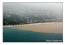 Runoff from a rain storm mixes with sea water off Lumley Beach.