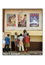 Children check upcoming films at the cinema.