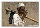 A Makeni farmer returns home from his garden.